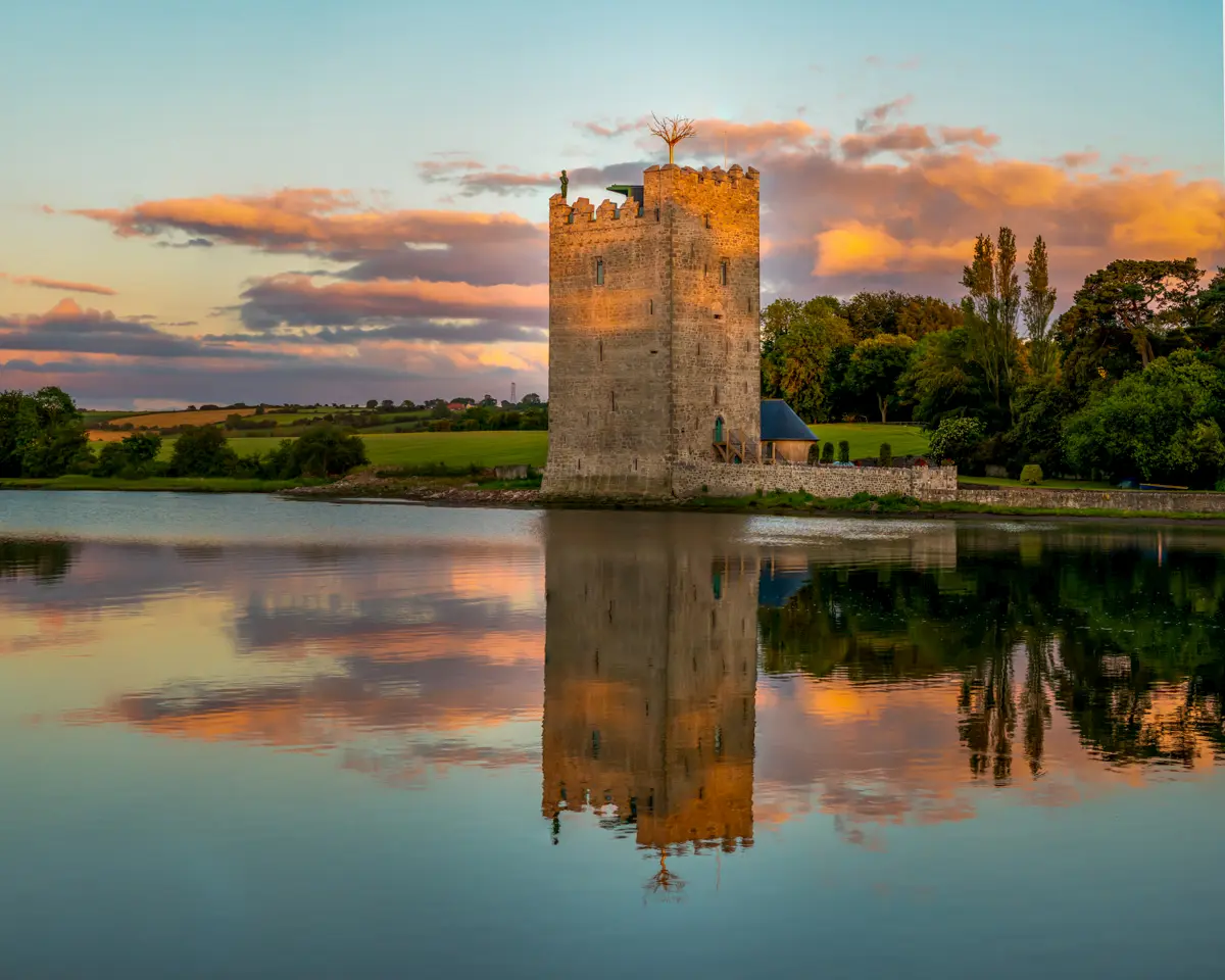 Belvelly Castle beside the water at sunset